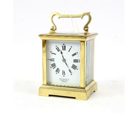 Early 20th century French brass carriage clock, striking the hours on a gong, the white enamel dial  signed John Walker Ltd, 