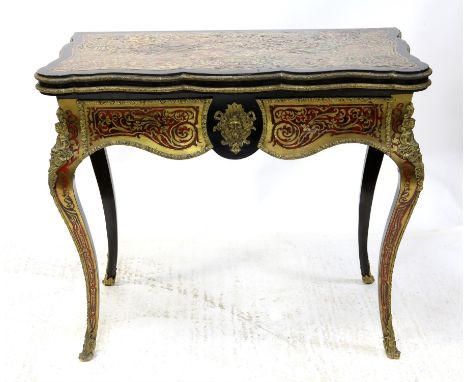 19th century French Boulle work foldover card table, the shaped top with foliate scroll design enclosing a red baize interior
