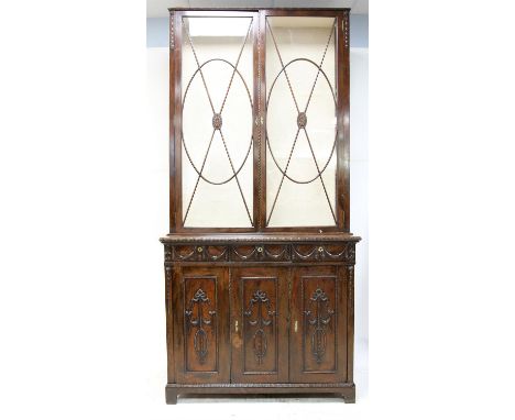 George III style mahogany neo-classical bookcase cabinet, the protruding beaded cornice over an associated glazed bookcase wi