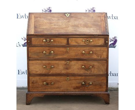 George III mahogany bureau, the slope fall enclosing pigeonholes and drawers over two short and three long graduated drawers 