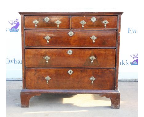 George I crossbanded walnut chest of drawers, the crossbanded top over panelled veneered sides and two short, and three long 