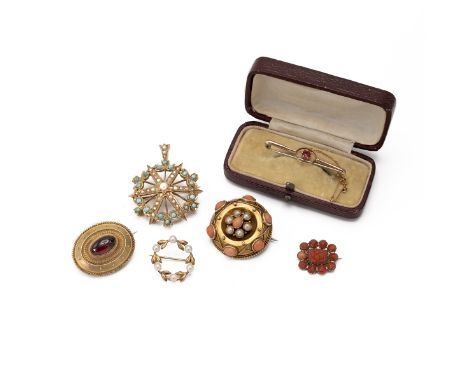 A Victorian coral and pearl brooch, locket back; with a Victorian garnet cabochon brooch; an early Victorian carved coral bro