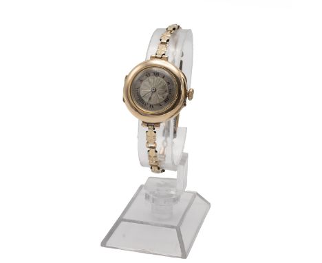 Antique 9ct yellow gold lady's wrist watch. 26mm case, manual wind, 15 jewels, silver engine turned dial with Roman numeral m