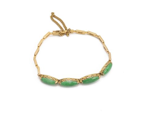 A four-stone jade bracelet, the marquise-shaped cabochons to a yellow metal bracelet with indistinct marks, 7.9g gross.