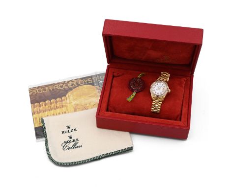 Ladies 18ct gold Rolex Oyster Perpetual Datejust superlative chronometer watch. 27mm case with aftermarket diamond and ruby b