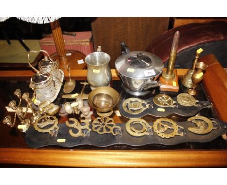 A quantity of various decorative brassware to include horse brasses, a Trench Art lighter etc.