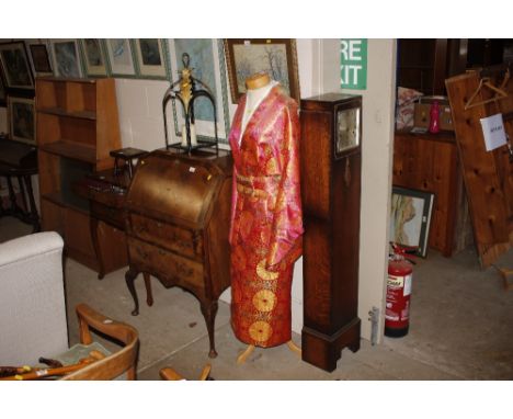 A Kimono and mannequin stand 
