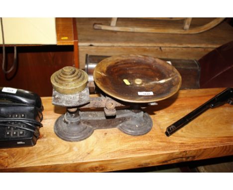 A set of cast iron and brass scales complete with weights 