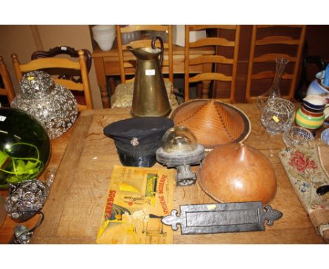 A brass water jug ; two Oriental wicker hats; a Prison Warders cap; an outside light; a letter box; and an advertising print 