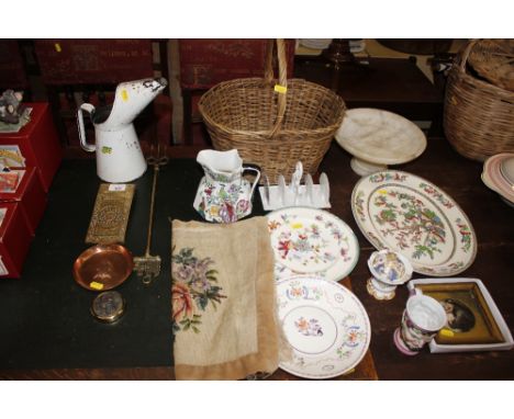 A wicker basket; a Copeland Spode jug; a floral decorated toast rack; a Worcester plate; and an unfamed needlework etc.