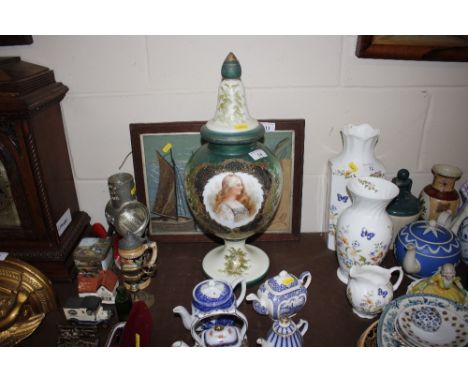 A Victorian opaque glass jar and cover decorated portrait and flowers 