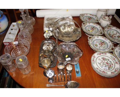 A plated swing handled fruit basket; a smaller example; various plated trophy cups; a sauce boat; dressing table set etc. 