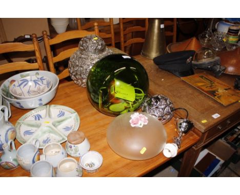 A large decorative light shade; a green glass lamp; and a floral decorated lampshade fitting 