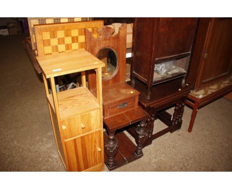 A pine bedside cupboard; a dressing table; a trinket chest; a carved occasional table; and a nest of three tables