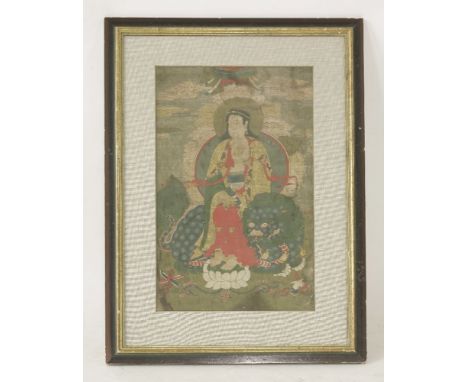 A gouache painting, late 19th century, of bodhisattva seated on a Buddhist lion, with his feet resting on a lotus, framed and