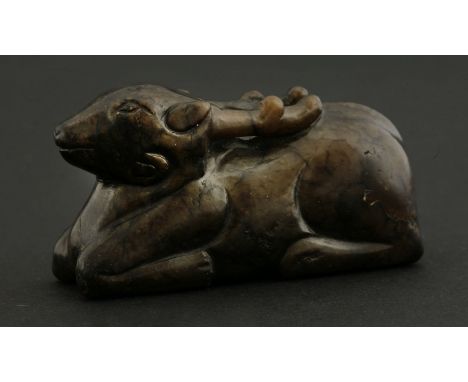 A jade Stag,18th century or earlier, its bitter-chocolate body at lodge, antlers resting on its back,7cmPurchased from Victor