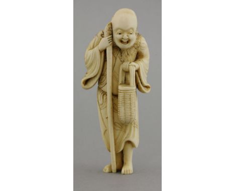 An ivory Sennin Netsuke,c.1800, the bearded figure holding a basket, staff and wearing a leaf shawl,10.3cm