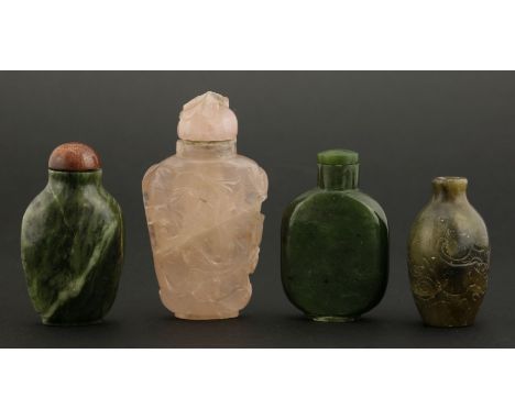 Four snuff bottles, 19th-20th century, three of jade, one engraved with an archaic dragon, the fourth rose quartz, carved wit