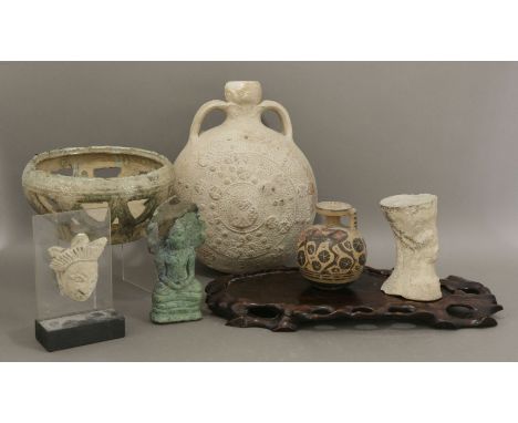 Miscellaneous ceramics, various dates, including a Han pierced bowl, a moulded moon flask, possibly Vietnamese, a mask, proba