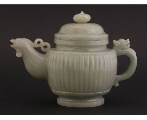 A jade Teapot and Cover,20th century, the ribbed body with cock spout and dragon handle, domed cover matching, all in a green