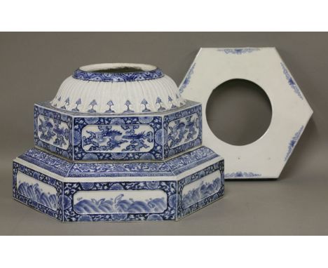 Parts of a porcelain garden lantern, c.1860, comprising an hexagonal base in two parts, with panels of spuming waves and drag