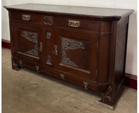 An Arts and Crafts mahogany sideboard, copper handles inset with Ruskin pottery roundels