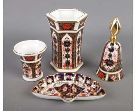 A collection of Royal Crown Derby 1128 Imari pattern ceramics to include fan shaped pin dish, two small vases and bell. Most 