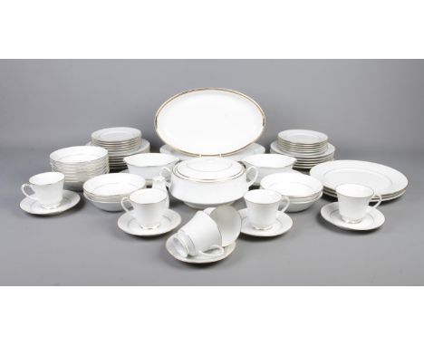 A box of Noritake dinnerwares in the 'Legendary' pattern. To include oval serving plates, cups and saucers, bowls and tureen.