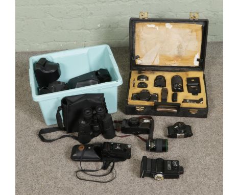 A boxed of assorted cameras and accessories to include Bullet Camera, Pentacon lenses, Pentax Zoom-70, Minolta Mac-Dual, case