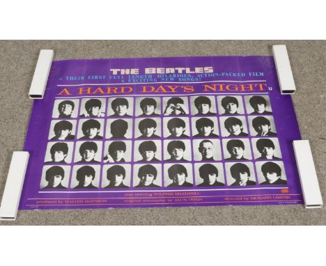 A reproduction The Beatles 1964 A Hard Day's Night promotional film poster. Approx. dimensions 100cm x 69cm.