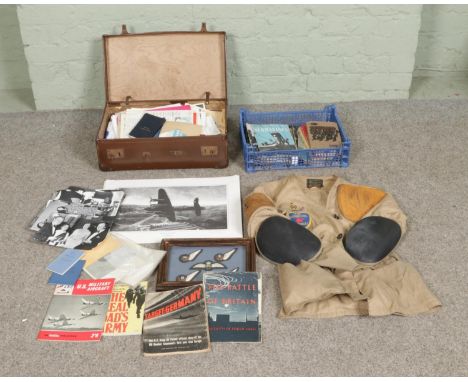 A box of assorted militaria along with a vintage suitcase with contents of mixed ephemera. Includes NSRA jacket by Buttstop, 