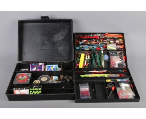 A black box of pole fishing equipment, including various floats, hooks, buffer beads etc.
