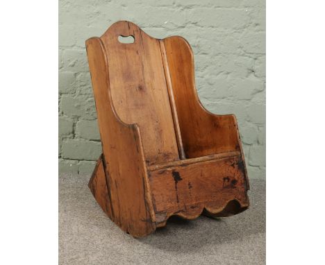 A 19th century child's rocking commode chair.