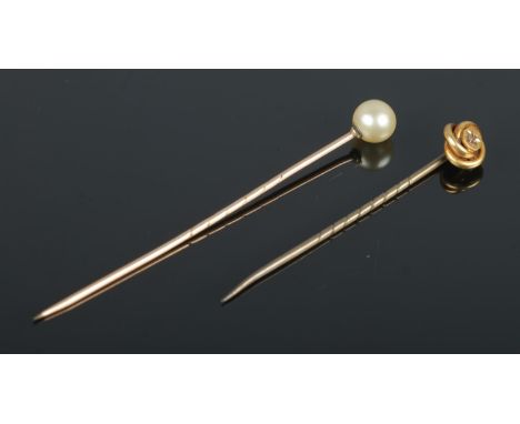 Two stick pins, consisting of pearl topped and 15ct Gold knot mounted example, set with single diamond within a star cut sett