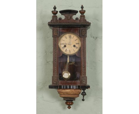 An early 20th century German musical Vienna wall clock, inscribed "Junghans" on the dial with Roman numerals, featuring a mus