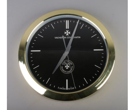 A Vacheron Constantin style wall clock, gold bezel with black dial with batton markers, quartz movement, diameter 40cm.  smal