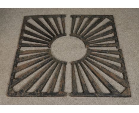 A cast iron four piece tree grate surround. Approx. external dimensions 120cm x 120cm.