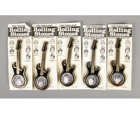 A complete set of five The Fabulous Rolling Stones guitar shaped brooches on backing card.