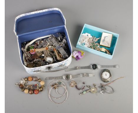 A collection of assorted costume jewellery and wristwatches to include Casio, Seiko, brooches, single silver earring, bracele