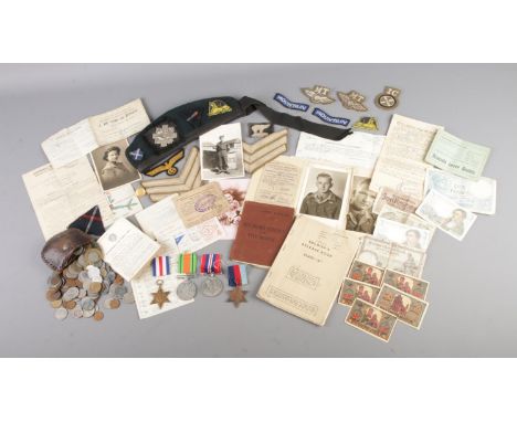 A collection of items relating to No. 3328670 Sgt. D.R Brear, Highland Light Infantry. Consisting of beret featuring cap badg