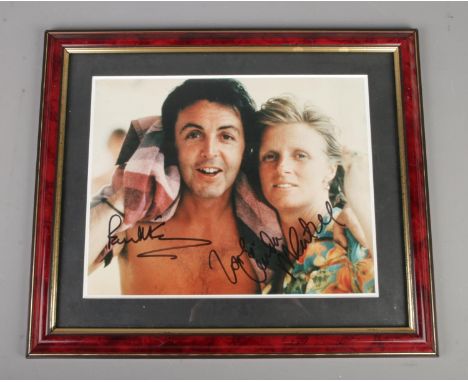 A framed Paul and Linda McCartney signed colour photograph with certificate of authenticity to reverse. Purportedly signed No