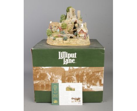 A boxed Lilliput Lane cottage 'Where Peaceful Waters Flow', Lilliput Lane's first water feature. With matching deed.  Tested 