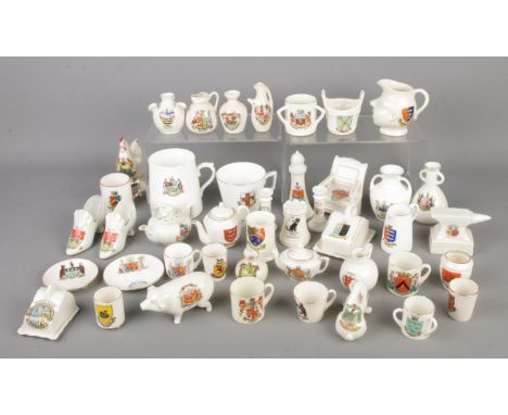 A collection of assorted crested ware including Arcadian and Goss examples.