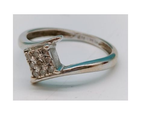 9ct white gold and diamond set ring. Size J, 1.4g. Shipping Group (A). 