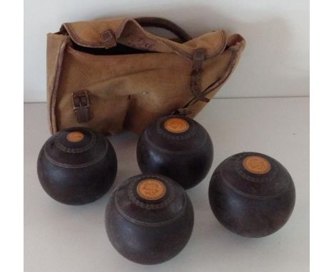 (4) vintage lawn bowls in holdall. Shipping Group (B). 
