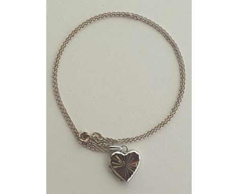 Silver heart-shaped locket on chain. Shipping Group (A). 