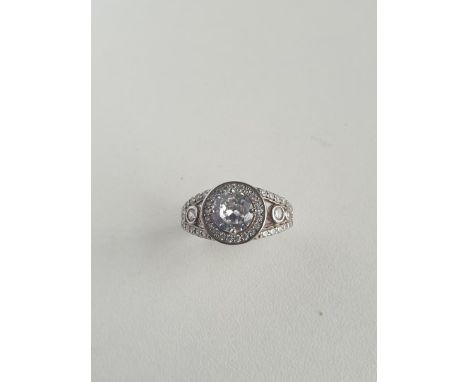 Silver solitaire and diamond set ring. Size Shipping Group (A). 