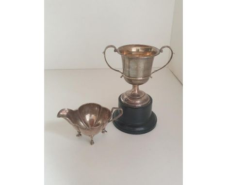 Silver sauce boat and double handed trophy, hallmarks for Sheffield and Birmingham. Shipping Group (A). 