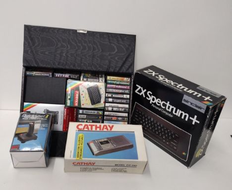 Vintage Sinclair ZX Spectrum+ in original box together with assorted games and peripherals. Shipping Group (A). 