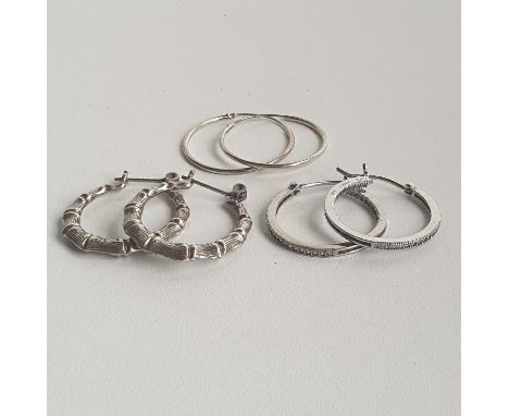 3 pairs of silver hoop earrings. Shipping Group (A). 